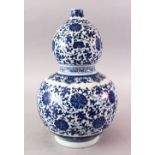 A 20TH CENTURY CHINESE MING STYLE BLUE & WHITE DOUBLE GOURD PORCELAIN VASE, the body decorated