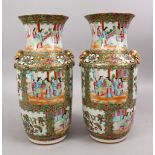 A PAIR OF 19TH CENTURY CHINESE CANTON FAMILLE ROSE PORCELAIN VASES, with panel decoration