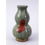 A CHINESE SONG STYLE CELADON & IRON RED CRACKLE GLAZED DOUBLE GOURD POTTERY VASE, with a ribbed