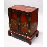 A 19TH CENTURY ORIENTAL / CHINESE RED LACQUER DECORATED TWO DOOR CHEST ON STAND, decorated with