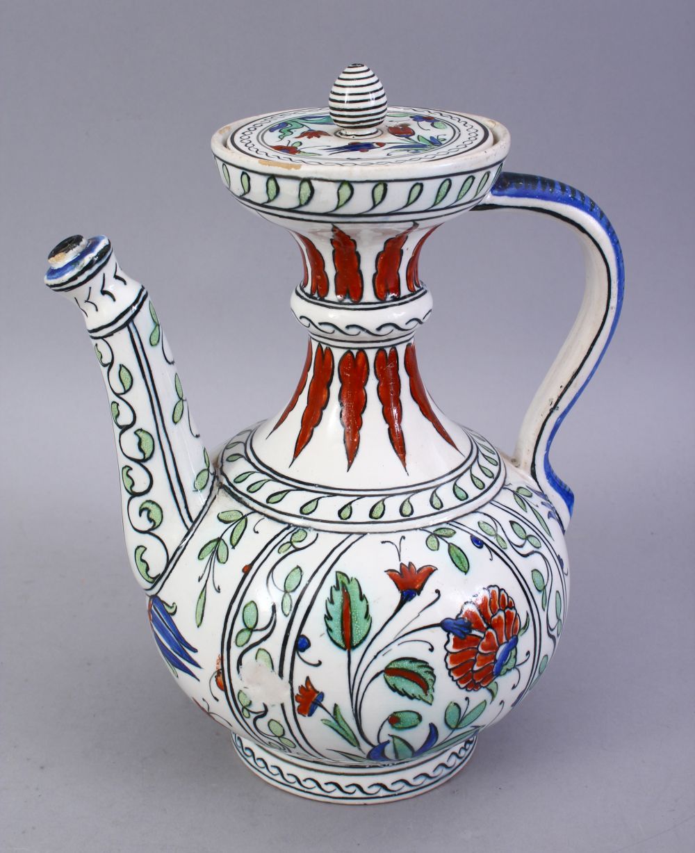 A GOOD TURKISH IZNIK STYLE POTTERY EWER, 22CM HIGH.