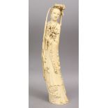 A 19TH CENTURY CHINESE CARVED IVORY FIGURE OF A FEMALE, 38cm high