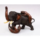 A JAPANESE BRONZE ELEPHANT AND TIGER GROUP OKIMONO, the elephant being attacked by two tigers,