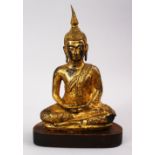 A GOOD QUALITY 19TH CENTUURY OR EARLIER THAI GILT BRONZE FIGURE OF BUDDHA, in a seated position upon