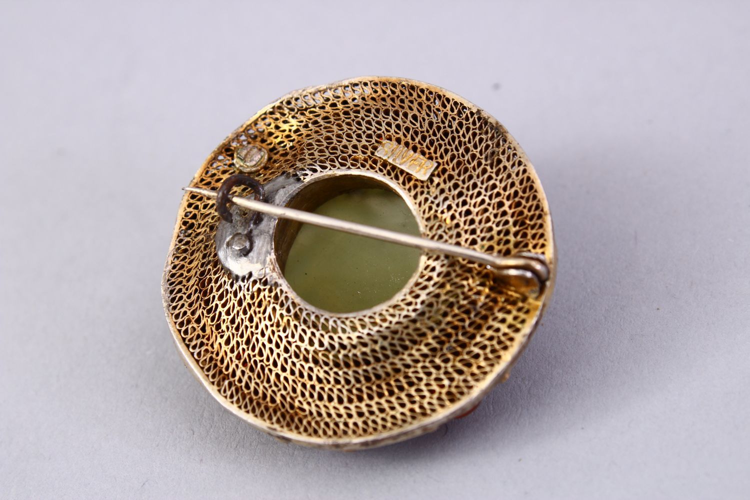 A GOOD INDIAN SILVER GILT & JADE BROOCH, with filigree work enclosing a floral carved jade centre, - Image 3 of 4