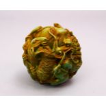 A CHINESE CARVED RESIN ZOOMORPHIC / ZODIAC BALL, 7CM.