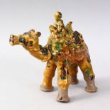 A GOOD TURKISH CANAKKALE POTTERY FIGURE OF A MAN UPON CAMEL BACK, the figure with three colour