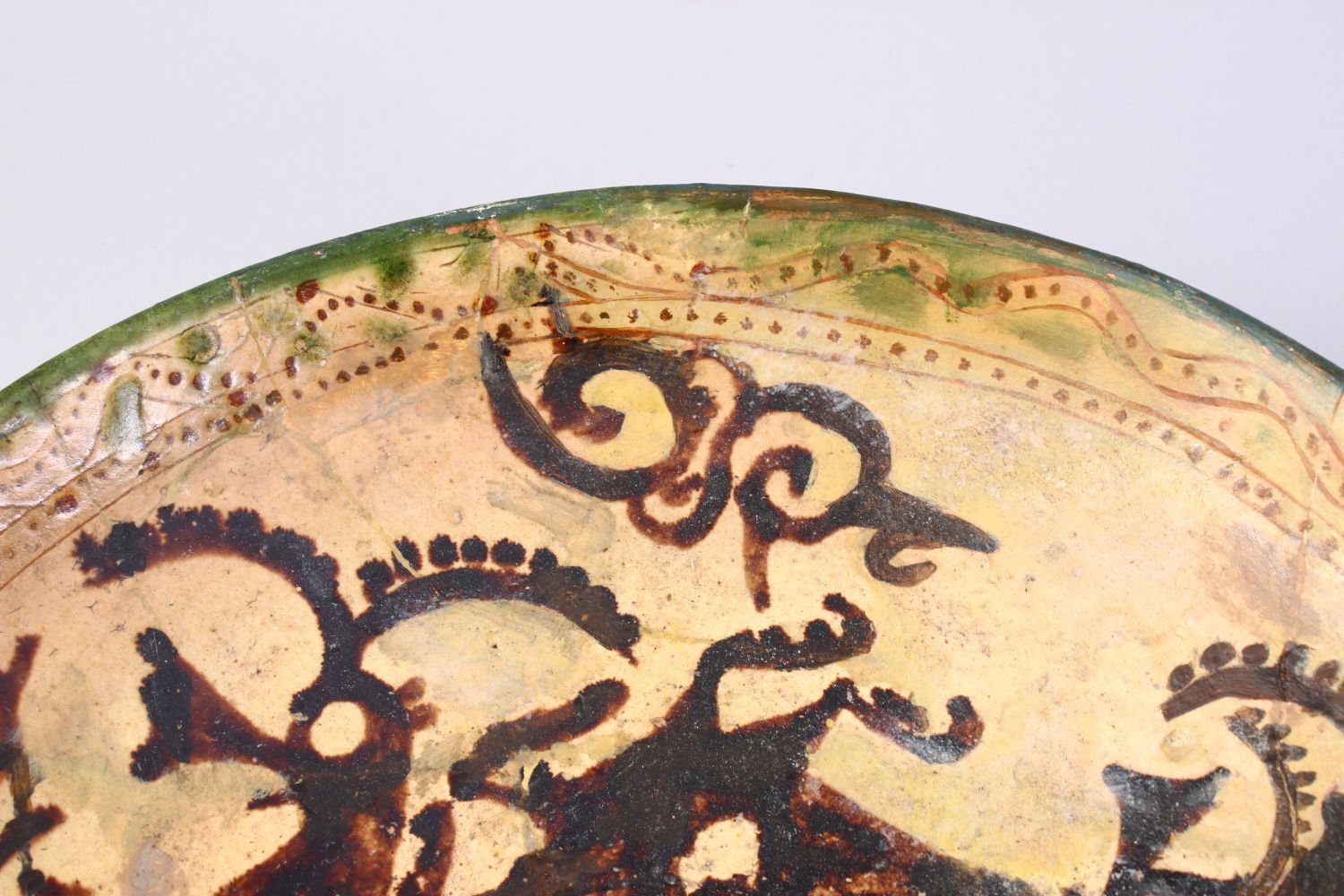 A GOOD EARLY ISLAMIC POTTERY DISH, decorated with animals, 33cm, AF - Image 3 of 4