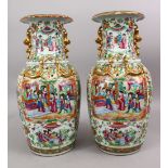 A PAIR OF 19TH CENTURY CHINESE CANTON FAMILLE ROSE PORCELAIN VASES, the white ground with panel