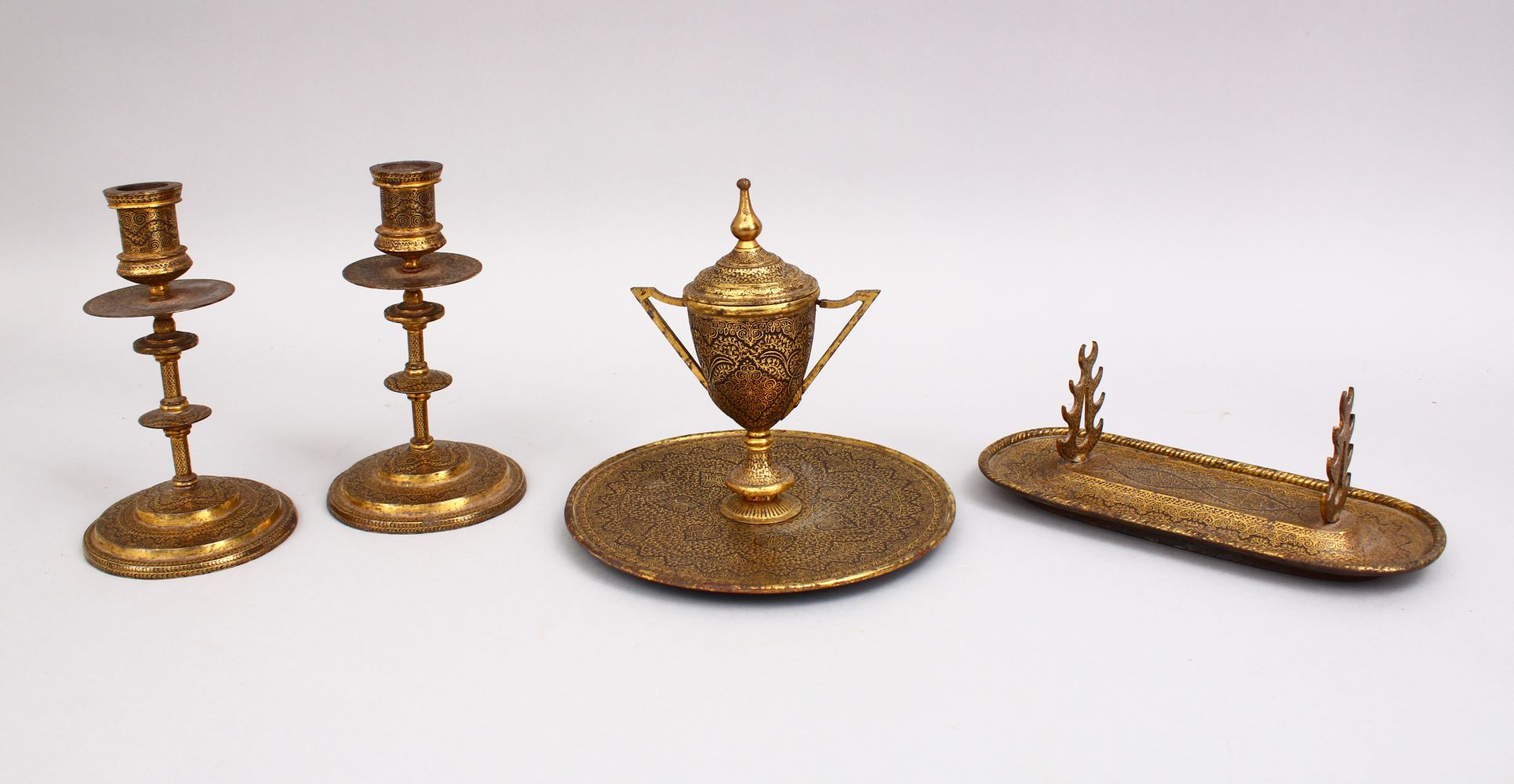 A 19TH CENTURY INDIAN DAMASCUS FOUR PIECE TABLE SET, comprising inkwell, pen holder and a pair of