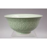 A GOOD CHINESE KANGXI STYLE CELADON CARVED PORCELAIN BOWL, The exterior carved with formal