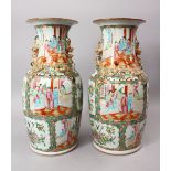 A OOD PAIR OF 19TH CENTURY CHINESE CANTON FAMILLE ROSE PORCELAIN VASES, each with panel decoration