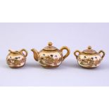 A MINIATURE JAPANESE MEIJI PERIOD THREE PIECE SATSUMA TEA SET, each item decorated with panels of