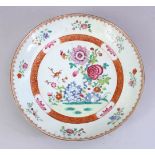 AN 18TH CENTURY CHINESE FAMILLE ROSE PORCELAIN DISH, with central display of flora, AF, 26cm