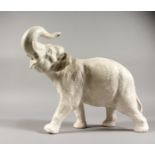 A LARGE BESWICK WHITE POTTERY ELEPHANT. 14ins long.