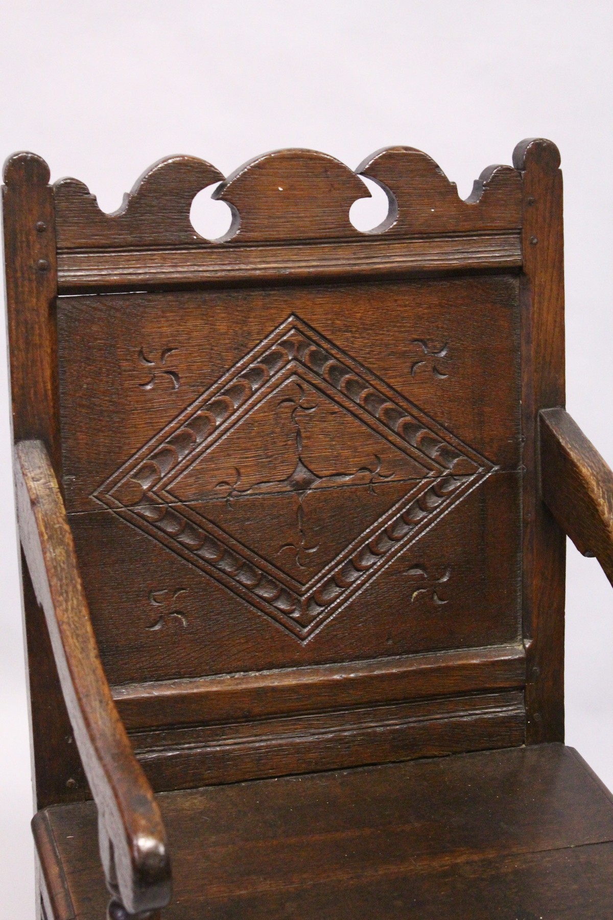 A 17TH CENTURY OAK WAINSCOTT CHAIR, with shaped cresting rail, carved back panel, the solid seat - Image 2 of 4