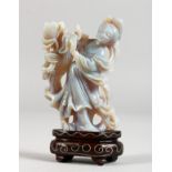AN UNUSUAL CHINESE CARVED OPAL FIGURE OF A LADY ON A STAND. Figure 2.5ins high.