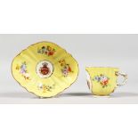 A 19TH CENTURY MEISSEN YELLOW GROUND CABARET CUP AND SAUCER crested and painted with flowers.