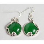 A PAIR OF SILVER AND JADE EARRINGS. 0.75ins diameter.