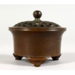 A SMALL CHINESE CIRCULAR BRONZE CENSER.