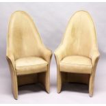 AN UNUSUAL PAIR OF LEATHER UPHOLSTERED HIGH BACK ARMCHAIRS, mid 20th Century. 3ft 11ins high x 2ft