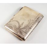A RUSSIAN SILVER CIGARETTE CASE, with engraved decoration and cabochon ruby thumb piece. 4.75ins x