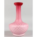 A PINK OPAQUE GLASS VASE, with interlaced design. 8ins high.