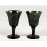 A SMALL PAIR OF JADE WINE CUPS. 3ins high.