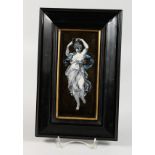 EN ENAMEL PLAQUE, probably Limoges, of a classical young lady playing a triangle, in an ebonised