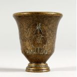 A CHINESE BRONZE MINIATURE WINE CUP. 2ins high.
