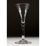 A GEORGIAN WINE GLASS with plain tapering bowl and stem. 6.75ins high.