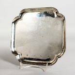 A GOOD GEORGE III SQUARE SHAPED SILVER SALVER on four bracket feet. 7ins square. London 1730.