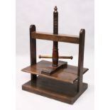 A GOOD 19TH CENTURY OAK TABLE TOP CLOTHES PRESS, with wood screw system. 2ft 2.5ins wide x 1ft