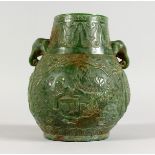 A CHINESE CARVED JADE VASE with elephant head handles. 6.5ins high.