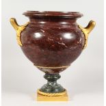 A SUPERB LOUIS XVITH ROUGE MARBLE TWO HANDLED URNS with ormolu handles, rope work and square base.