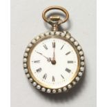 A LADIES' ENAMEL BACK FOB WATCH with seed pearl surround.