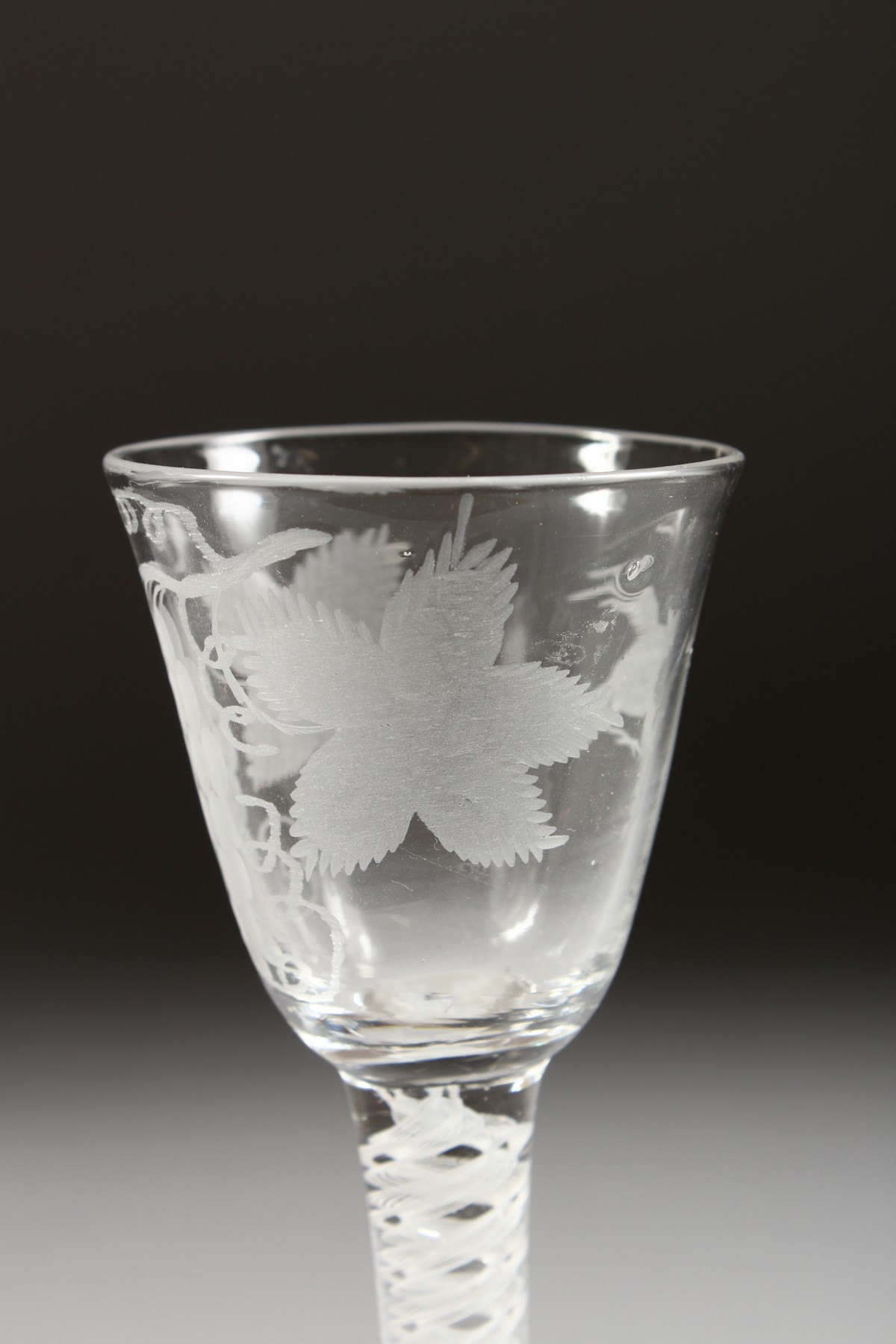 A GEORGIAN WINE GLASS, the bowl engraved with fruiting vines with white twist stem. 5.25ins high. - Image 3 of 7