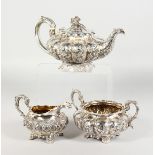 A GOOD WILLIAM IV SILVER THREE PIECE TEA SET, circular melon shape repousse with acanthus and