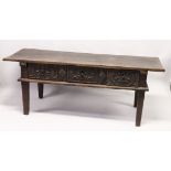AN 18TH CENTURY SPANISH OAK SERVING TABLE with a single plank top, three carved frieze drawers on