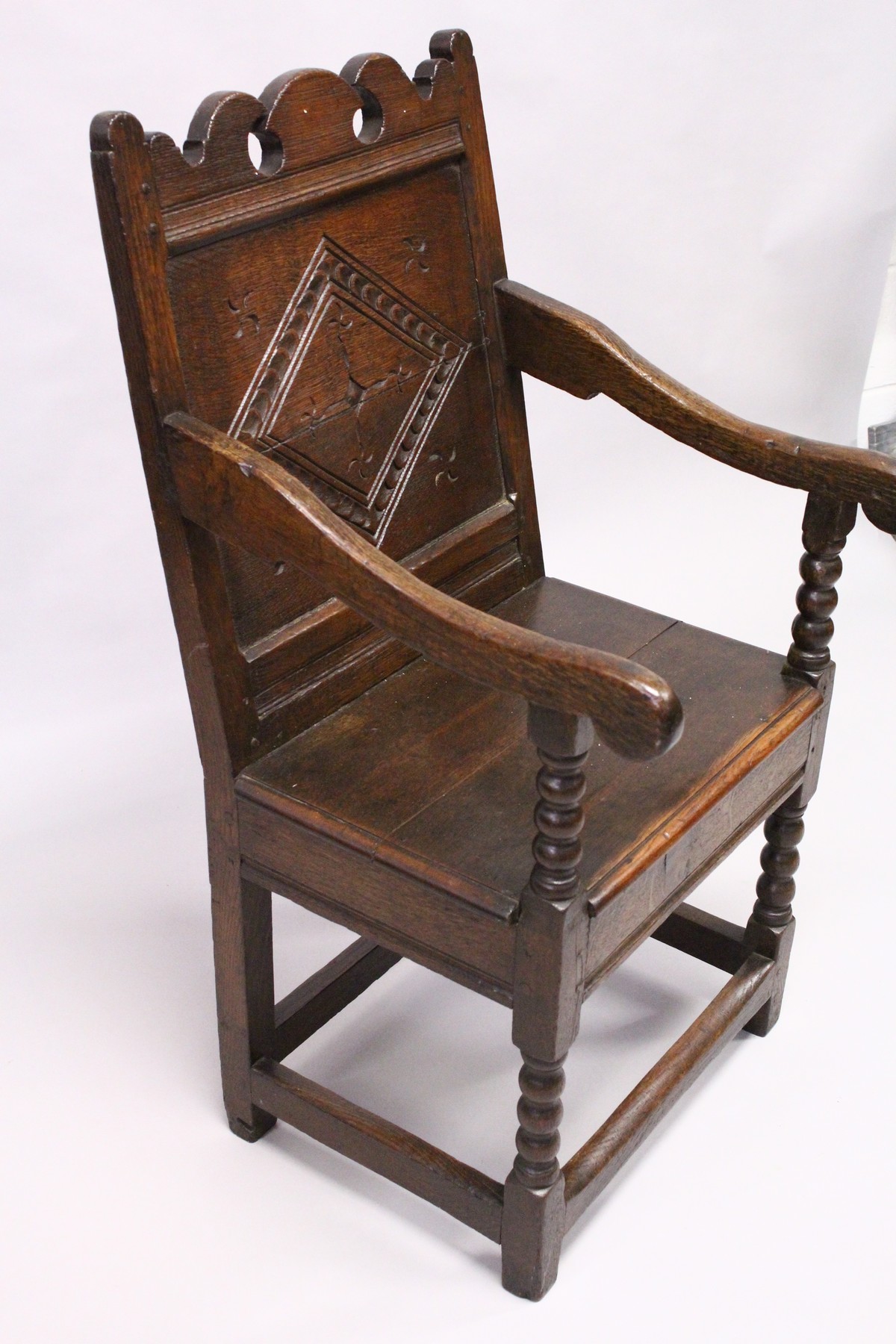 A 17TH CENTURY OAK WAINSCOTT CHAIR, with shaped cresting rail, carved back panel, the solid seat - Image 3 of 4