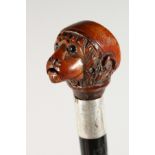 A RARE ARTICULATED HEAD HANDLE WALKING STICK, formed as a talking monkey. 35ins long.