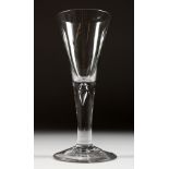 A LARGE PLAIN GEORGIAN WINE GLASS with long tapering bowl.