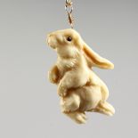 A VINTAGE DESIGNER RALPH MASSEY (born 1938) BUNNY RABBIT and chain.