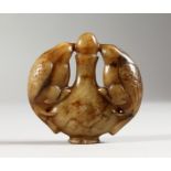 A CARVED JADE ROUNDEL. 2ins wide.