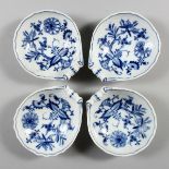 A SET OF FOUR MEISSEN PORCELAIN ONION PATTERN SHELL SHAPED DISHES. Cross swords mark in blue. 4.