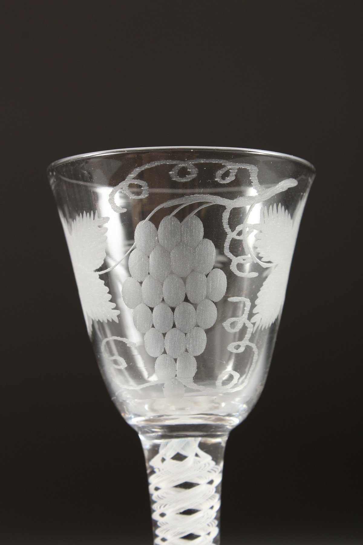 A GEORGIAN WINE GLASS, the bowl engraved with fruiting vines with white twist stem. 5.25ins high. - Image 2 of 7