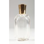 AN 18CT GOLD MOUNTED CUT GLASS SCENT BOTTLE. 3.25ins high.