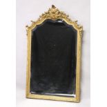 A GOOD 19TH CENTURY GILT FRAMED PIER MIRROR with shell, flowerhead and "C" scroll cresting and shell