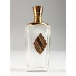 AN 18CT GOLD MOUNTED CUT GLASS SCENT BOTTLE. 3.5ins high.