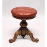 A VICTORIAN MAHOGANY CIRCULAR SWIVEL TOP PIANO STOOL with padded leather top.